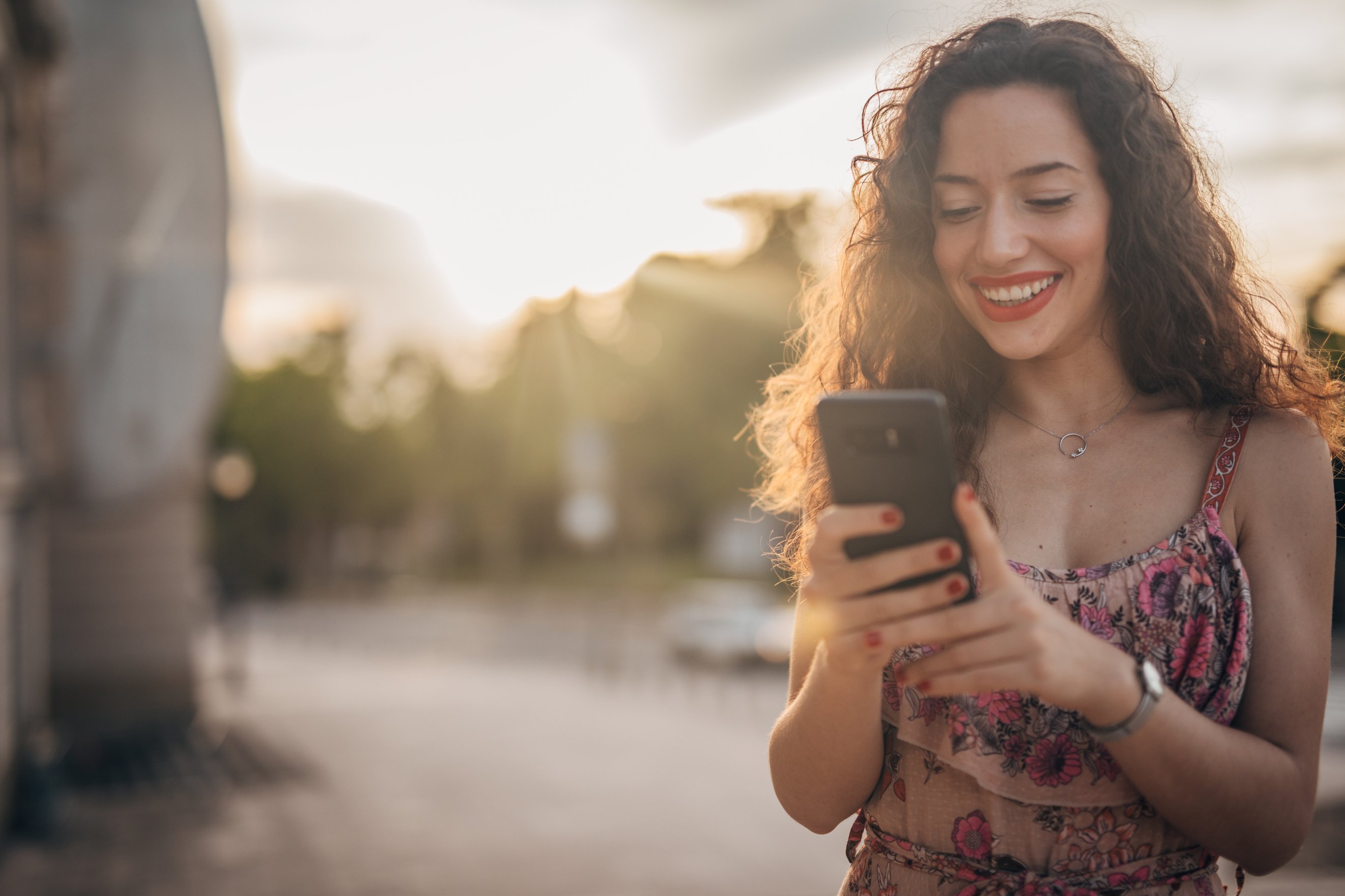 Beautiful Spanish woman using mobile